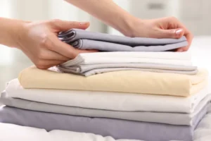 É preciso lavar os lençóis novos antes de os pôr na cama?